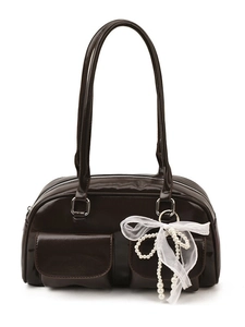 Deep brown Boston underarm bag with glossy finish and elegant pearl bow charm accessory