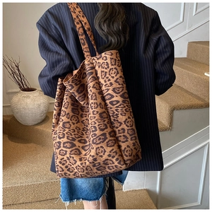 Detail of leopard print tote bag with soft suede texture and large capacity shoulder strap