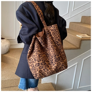 Detail view of large capacity leopard print tote bag with soft suede texture finish