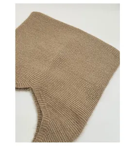 Close-up of khaki knitted fabric showing premium fuzzy texture and rib pattern