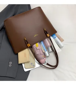 Top view of a brown vintage tote bag showing large interior space for daily essentials