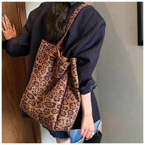 Leopard print tote bag showing large capacity and soft texture on a model shoulder