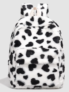 Fuzzy cow print backpack for students featuring black heart patterns and front pocket