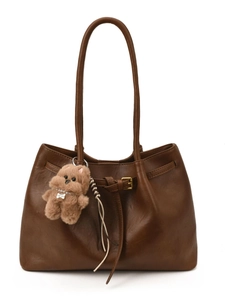 Classic dark brown leather tote bag with long straps and cute puppy pendant accessory