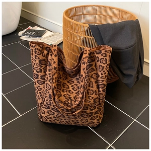 Detailed view of the leopard print tote bag with soft suede texture and large capacity
