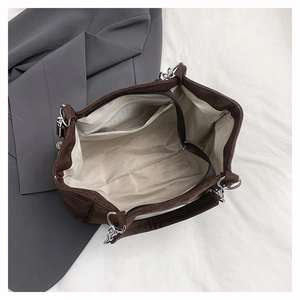Detail view of the spacious leopard print tote interior with beige lining and zip pocket