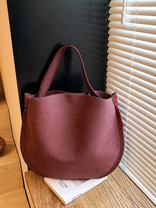 Vintage large burgundy suede tote bag with woven trim and spacious interior design