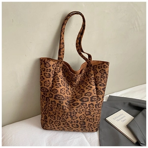 Close-up of leopard print tote bag showing the soft suede texture and sturdy double handles
