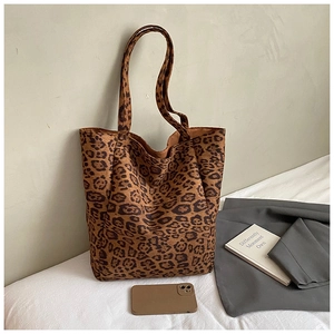 Close-up of leopard print tote bag with soft suede texture and large capacity design