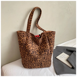 Close-up of leopard print tote bag with soft suede texture and large capacity design