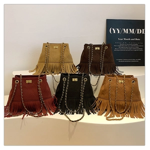 Detailed view of tassel chain bucket bags in five colors with diamond quilting and gold locks