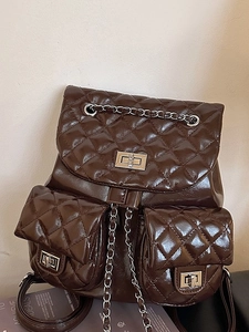 Quilted diamond pattern brown backpack with silver chain straps and turn-lock closures