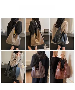 Detail view of large capacity hobo bags in caramel and black faux leather finish