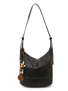 Minimalist black leather hobo bag with bohemian beaded tassel and wooden charm detail