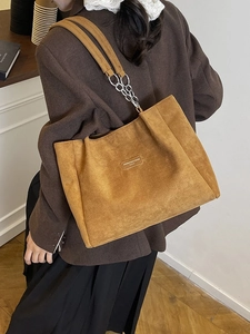 Brown leopard-style faux suede tote bag with metal chain strap and leather patch