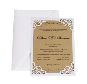 Invitation de mariage épurée découpée au laser avec motif floral blanc et papier kraft