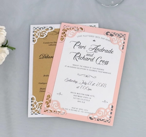 Laser-cut floral wedding invitation with elegant hollow patterns and golden insert card
