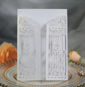 Detailed laser-cut gatefold wedding invitation with intricate pearl white floral patterns