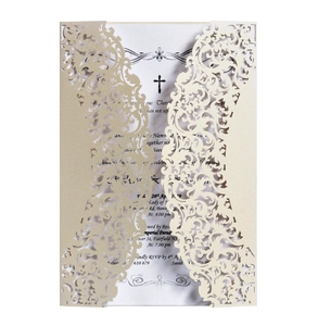 Detail of laser cut champagne gold lace wedding invitation with pearlized texture