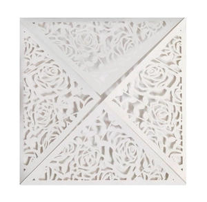 Elegant laser cut white pearl paper wedding invitation with intricate rose flower hollows