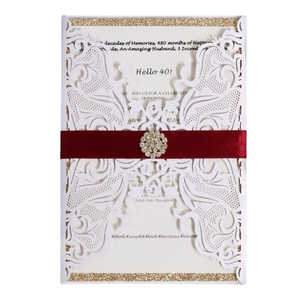 White laser cut lace invitation with red ribbon and rhinestone for 40th birthday card
