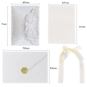 Laser cut black floral wedding invitation set with white envelopes and gold seals