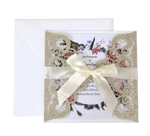 Elegant laser-cut wedding invitation set with golden glitter finish and floral inner page
