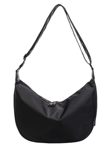 Minimalist black nylon crescent bag featuring a geometric patterned adjustable wide strap