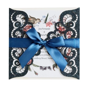 Laser cut navy blue glitter wedding invitation with silk ribbon and floral insert