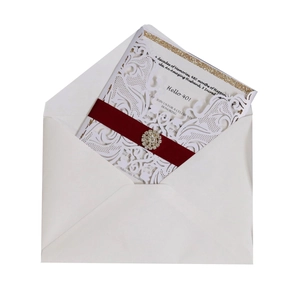Laser-cut 40th anniversary invitation card with burgundy ribbon and rhinestone brooch