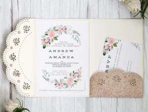 Intricate laser-cut floral wedding invitation with gold glitter RSVP pocket and ivory finish
