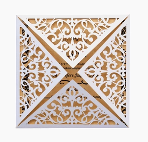 Elegant laser-cut wedding invitation set with white floral cover and kraft paper inserts