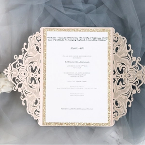 Laser cut floral lace wedding invitation in peach pink with gold glitter frame insert