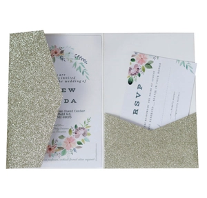 Detail of glitter gold wedding invitation pocket with floral watercolor card inserts