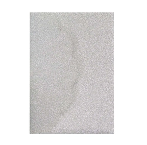 Detail showing the fine texture of silver glitter paper for elegant wedding invitations