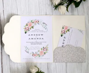 Elegant ivory laser-cut wedding invitation set with silver glitter and floral cards