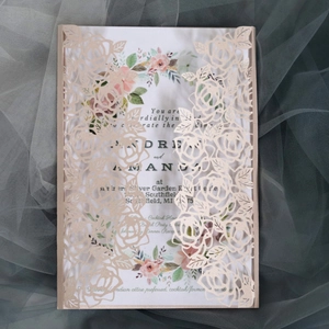 Pink laser-cut rose wedding invitation with watercolor floral inner card and ribbon