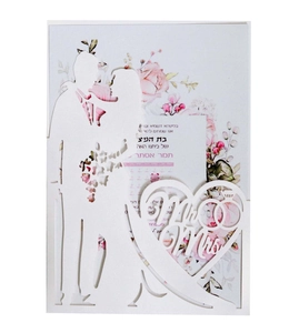 Detailed laser-cut wedding invitation featuring a silhouette of a couple and Mr & Mrs text