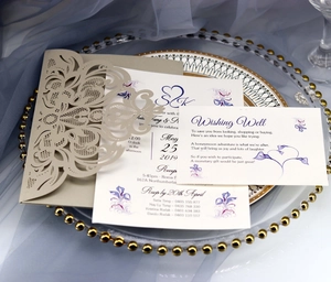 Elegant laser-cut floral wedding invitation set in champagne gold with white insert cards