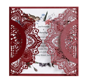 Detailed laser cut burgundy invitation card with elegant floral and bird print insert