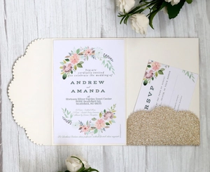 Detail of elegant wedding invitation set with gold glitter pocket and floral RSVP card