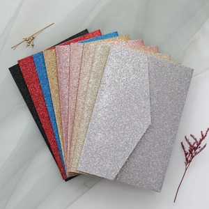 Macro view of multi-color glitter envelopes with premium sparkling textured finish