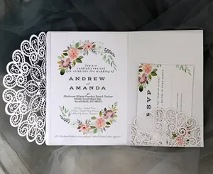 Elegant laser cut wedding invitation set with floral card and RSVP on a lace white pocket