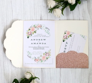 Elegant laser-cut wave wedding invitation set with floral card and rose gold glitter slot