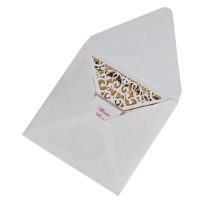 Detailed laser-cut white lace wedding invitation set with elegant floral vine patterns