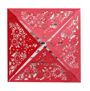 Elegant laser cut red floral wedding invitation card with white insert from top view
