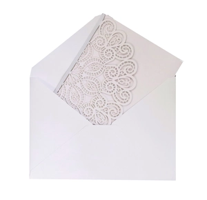Elegant laser-cut lace invitation set with white pearlescent paper and matching envelope