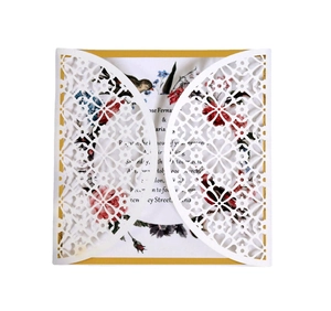 Laser cut white wedding invitation with floral patterns and birds printed inner card