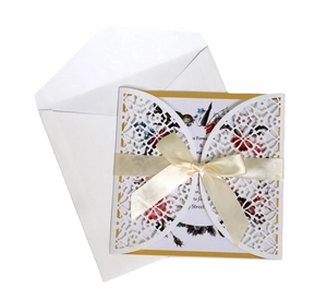 Laser-cut floral wedding invitation card set with white hollow cover and silk ribbon bow