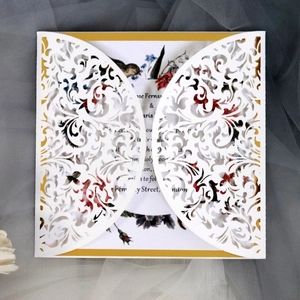 Laser cut white wedding invitation with floral card and elegant lace pattern